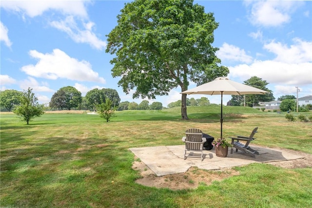 12 Windward Cir, Warwick, RI 02889 - view of green lawn featuring a patio area