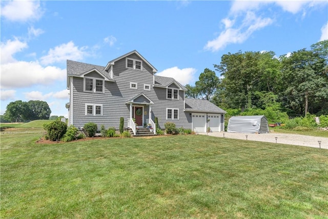 12 Windward Cir, Warwick, RI 02889 - view of front of house featuring driveway, an attached garage, a front yard, and roof with shingles