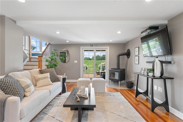 12 Windward Cir, Warwick, RI 02889 - living area featuring a wood stove, stairs, plenty of natural light, recessed lighting, and light wood finished floors