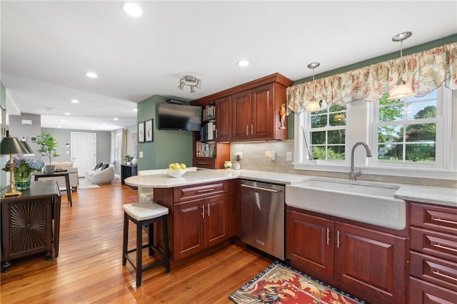 12 Windward Cir, Warwick, RI 02889 - kitchen with dishwasher, a peninsula, light wood-style flooring, recessed lighting, and decorative backsplash