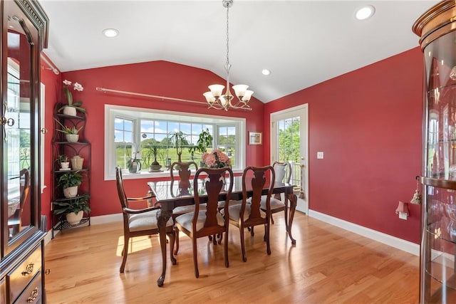 12 Windward Cir, Warwick, RI 02889 - dining area with a chandelier, vaulted ceiling, light wood-type flooring, and recessed lighting