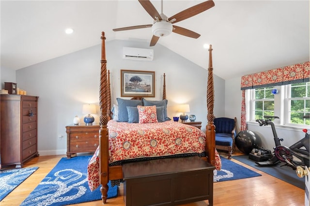 12 Windward Cir, Warwick, RI 02889 - bedroom featuring a wall mounted air conditioner, lofted ceiling, wood finished floors, and a ceiling fan