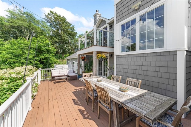 12 Windward Cir, Warwick, RI 02889 - wooden deck with an outdoor living space and outdoor dining area