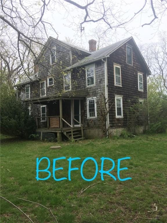 12 Windward Cir, Warwick, RI 02889 - back of house featuring a chimney, a lawn, and a deck
