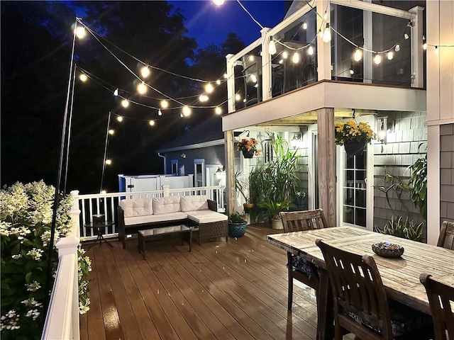 12 Windward Cir, Warwick, RI 02889 - deck at night featuring an outdoor hangout area and outdoor dining space