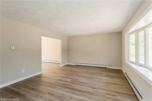 22 T Parker Rd, Foster, RI 02825 - unfurnished room with a baseboard radiator, baseboard heating, and light wood-style floors