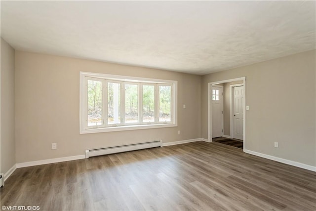 22 T Parker Rd, Foster, RI 02825 - unfurnished living room with a baseboard heating unit and wood finished floors