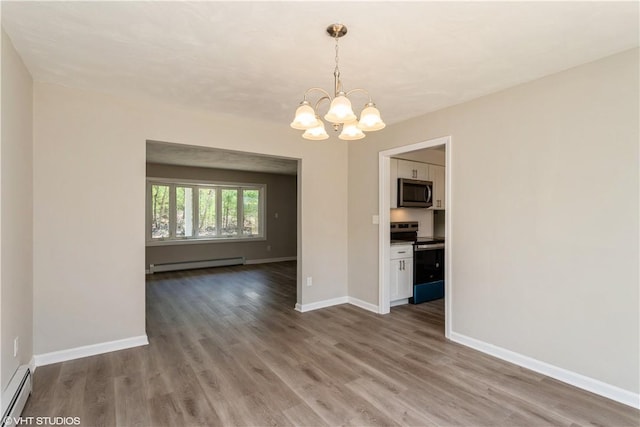 22 T Parker Rd, Foster, RI 02825 - spare room featuring a baseboard radiator, a chandelier, wood finished floors, and a baseboard heating unit