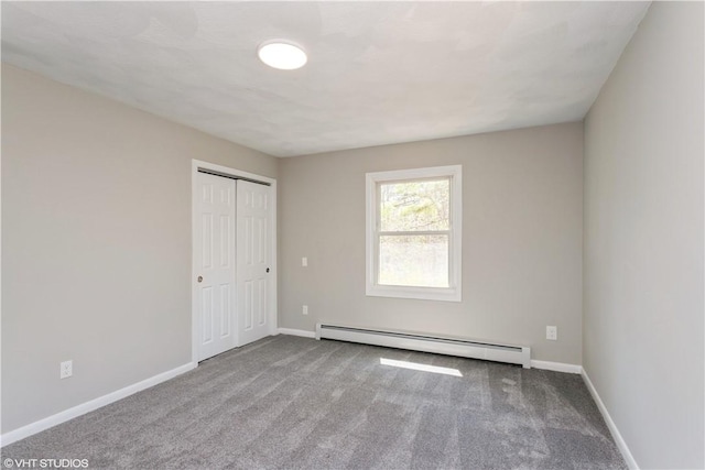 22 T Parker Rd, Foster, RI 02825 - unfurnished bedroom featuring a baseboard radiator, carpet flooring, and a closet