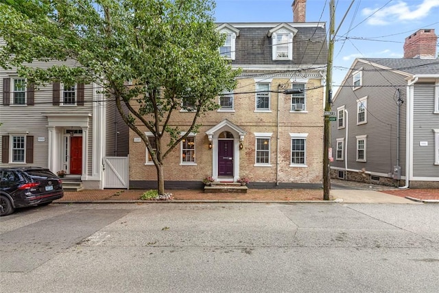 22 Arnold St, Providence, RI 02906 - view of front of house featuring mansard roof and a chimney