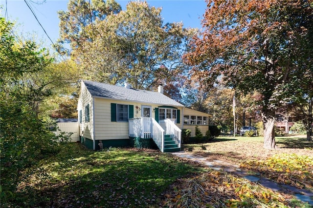 223 Mautucket Rd, South Kingstown, RI 02879 - bungalow featuring a chimney and a front yard