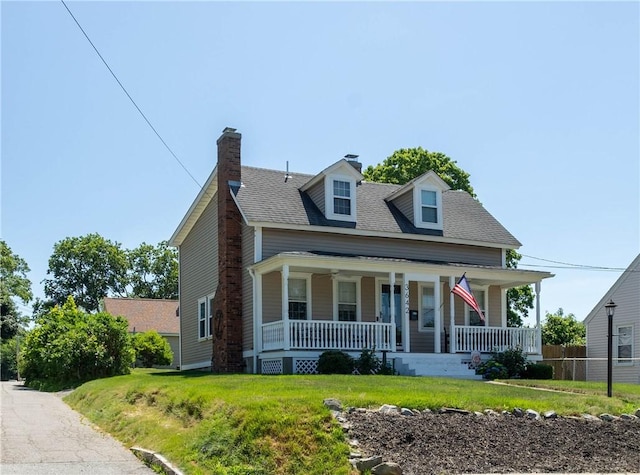 3642 Pawtucket Ave, East Providence, RI 02915 - view of front facade featuring covered porch, a front lawn, a chimney, and a shingled roof