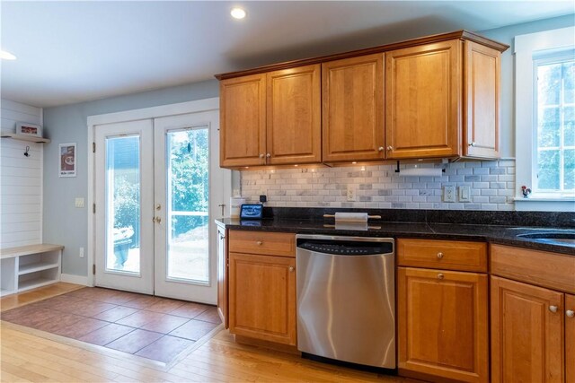 3642 Pawtucket Ave, East Providence, RI 02915 - kitchen with stainless steel dishwasher, french doors, backsplash, light wood finished floors, and brown cabinetry