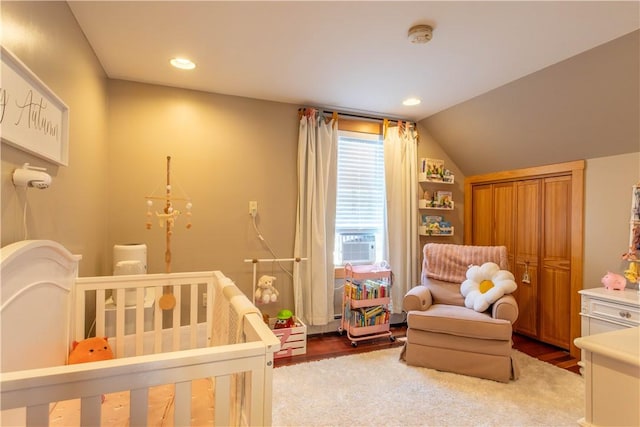 3642 Pawtucket Ave, East Providence, RI 02915 - bedroom with cooling unit, lofted ceiling, a crib, wood finished floors, and recessed lighting
