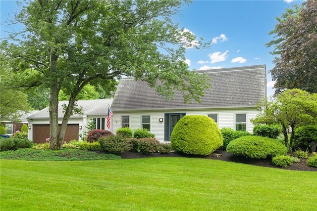 69 Apple Tree Ln, Warwick, RI 02888 - view of front of house featuring a garage, a front yard, and a shingled roof
