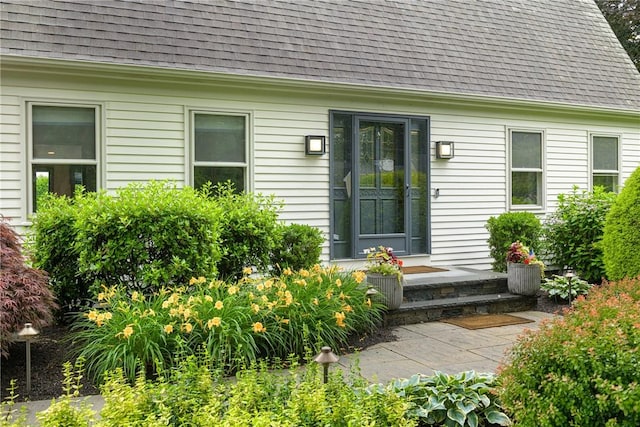 69 Apple Tree Ln, Warwick, RI 02888 - view of exterior entry featuring a shingled roof