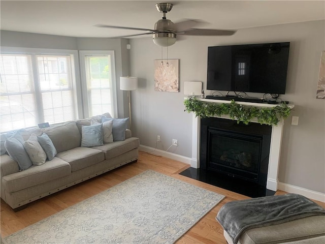 20 Winston Way, Johnston, RI 02919 - living area with a ceiling fan, wood finished floors, and a fireplace with flush hearth