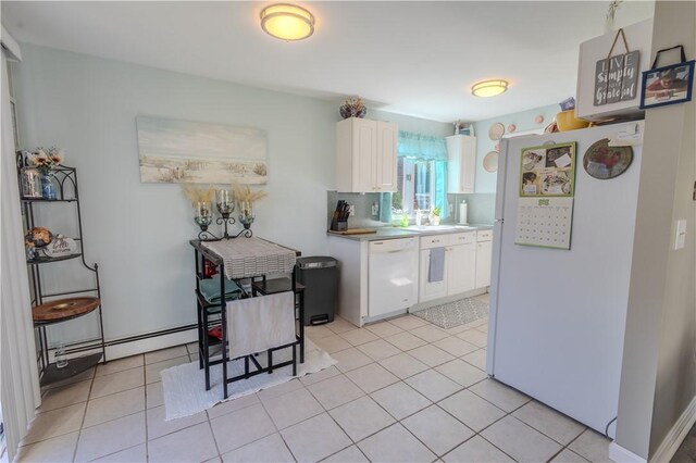 151 Willet Ave Unit 5, East Providence, RI 02915 - kitchen with white appliances, white cabinets, light tile patterned flooring, and light countertops