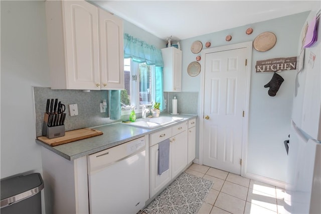 151 Willet Ave Unit 5, East Providence, RI 02915 - kitchen featuring white appliances, white cabinets, backsplash, light tile patterned floors, and light countertops