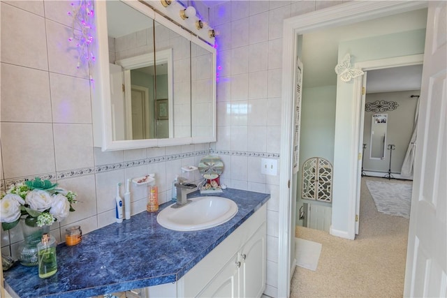 151 Willet Ave Unit 5, East Providence, RI 02915 - bathroom with vanity, tile walls, and backsplash