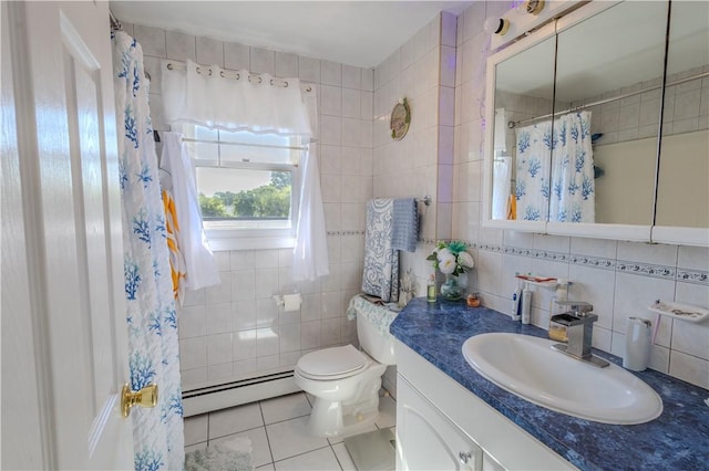 151 Willet Ave Unit 5, East Providence, RI 02915 - bathroom with a baseboard radiator, tile walls, vanity, tile patterned flooring, and a shower with curtain