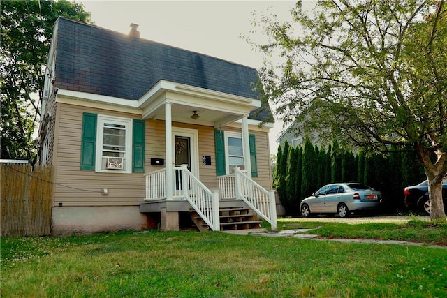 23 Majestic Ave, Warwick, RI 02888 - view of front of house featuring a front lawn and roof with shingles