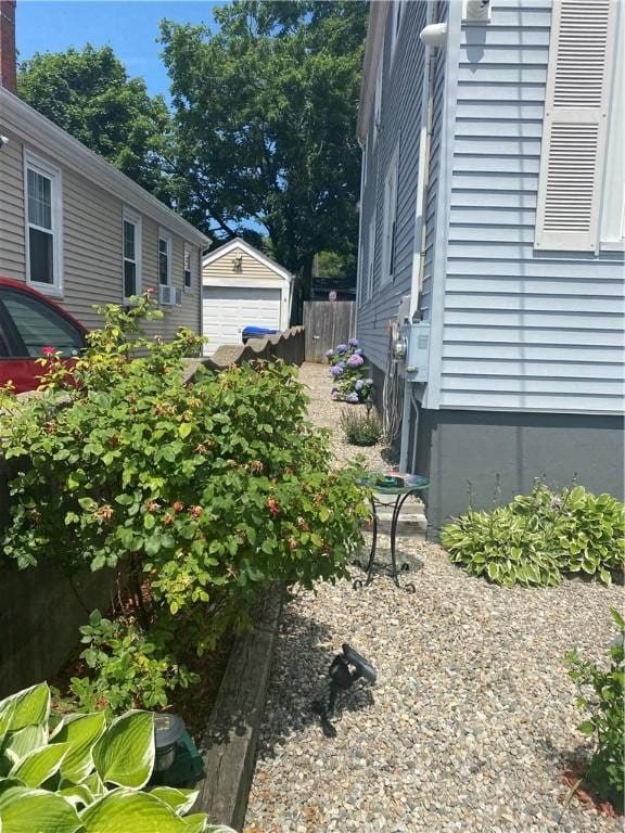 26 Anchor St, Providence, RI 02908 - view of yard featuring an outdoor structure and a detached garage