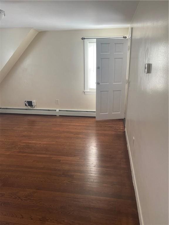 26 Anchor St, Providence, RI 02908 - additional living space featuring dark wood-type flooring and a baseboard radiator