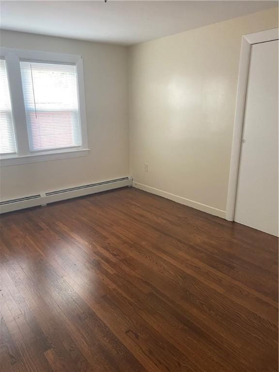 26 Anchor St, Providence, RI 02908 - unfurnished room featuring a baseboard radiator and dark wood finished floors