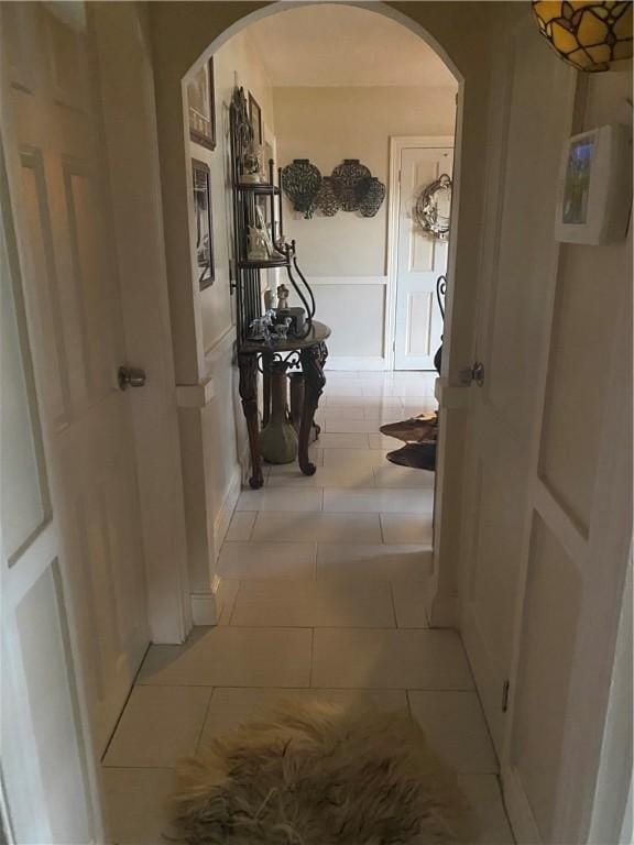 26 Anchor St, Providence, RI 02908 - hallway featuring arched walkways and light tile patterned flooring