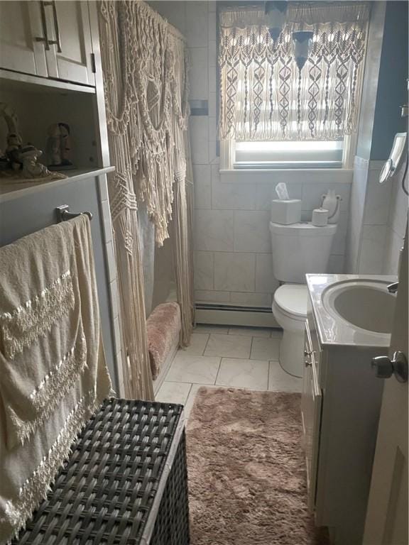 26 Anchor St, Providence, RI 02908 - full bath featuring marble look tile flooring, vanity, a baseboard heating unit, and shower / bath combination with curtain