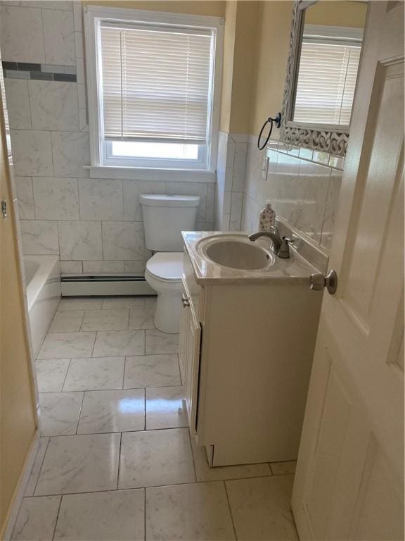 26 Anchor St, Providence, RI 02908 - bathroom with vanity, tile walls, marble finish floors, a baseboard radiator, and a wainscoted wall