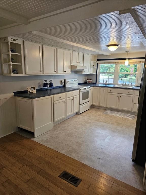 41 Park Ln, Coventry, RI 02816 - kitchen with white electric range, open shelves, light wood-style floors, dark countertops, and beamed ceiling