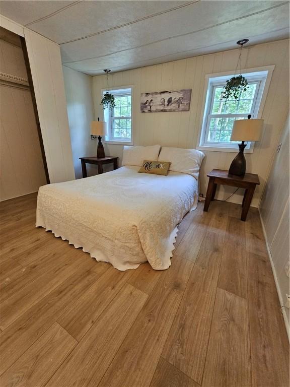 41 Park Ln, Coventry, RI 02816 - bedroom featuring wood finished floors and wooden walls