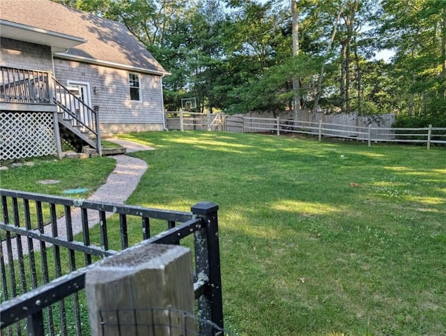 56 Ocean Ridge Dr, Charlestown, RI 02813 - fenced backyard featuring stairs and a deck