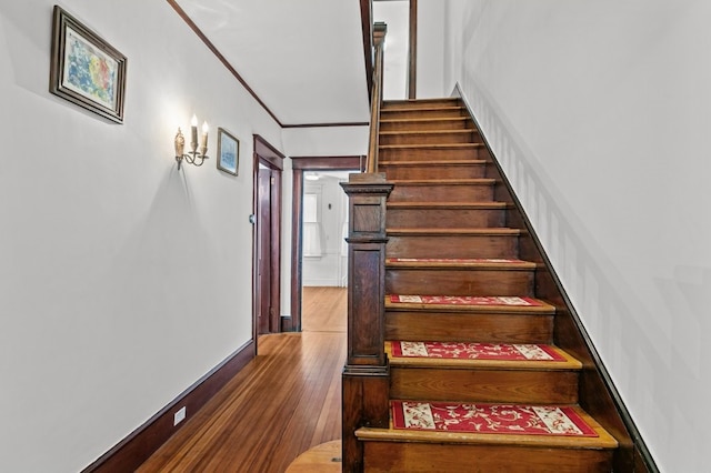 32 Thurston Ave Unit A, Newport, RI 02840 - staircase featuring wood finished floors and crown molding