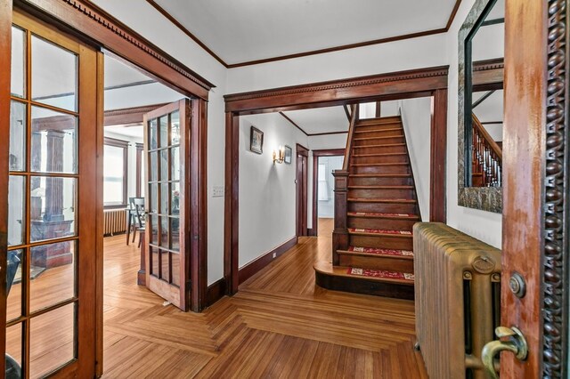 32 Thurston Ave Unit A, Newport, RI 02840 - staircase featuring radiator heating unit, crown molding, and french doors
