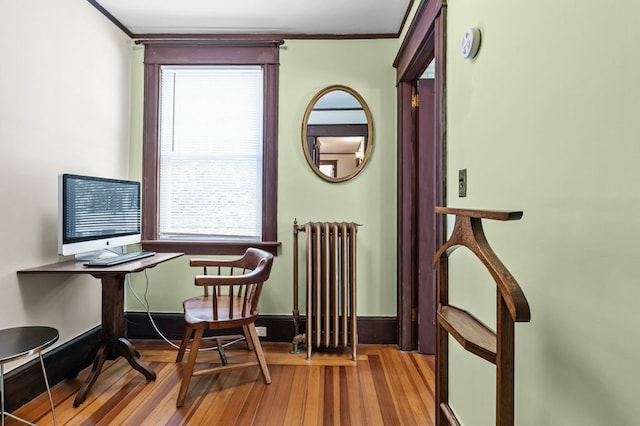 32 Thurston Ave Unit A, Newport, RI 02840 - home office featuring radiator heating unit, wood finished floors, and ornamental molding