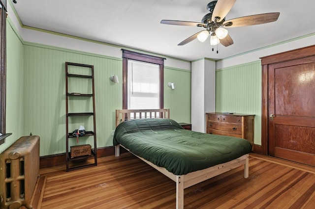 32 Thurston Ave Unit A, Newport, RI 02840 - bedroom featuring radiator, light wood finished floors, and ceiling fan