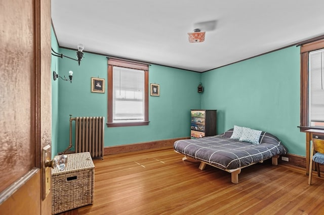 32 Thurston Ave Unit A, Newport, RI 02840 - bedroom with radiator heating unit and wood finished floors