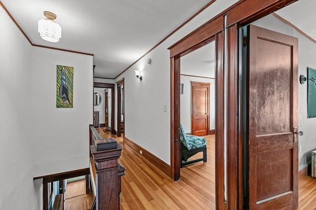 32 Thurston Ave Unit A, Newport, RI 02840 - corridor featuring light wood-style flooring, ornamental molding, and an upstairs landing