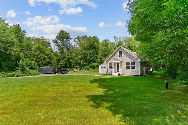 8 Anthony Rd, Foster, RI 02825 - view of grassy yard with driveway and a garage