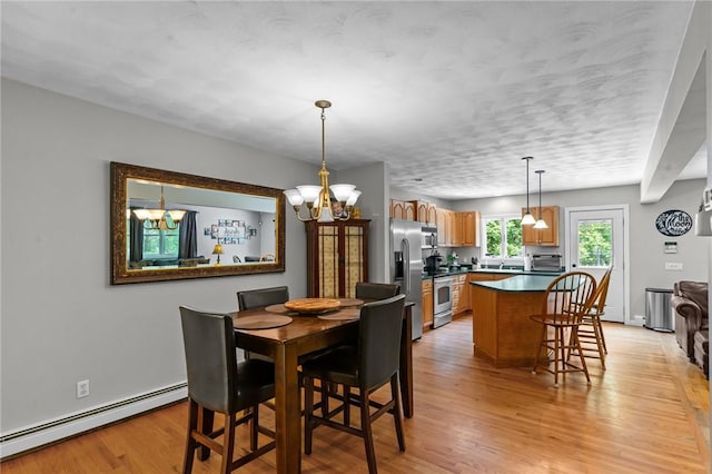 8 Anthony Rd, Foster, RI 02825 - dining room with baseboard heating, a chandelier, and light wood-style flooring