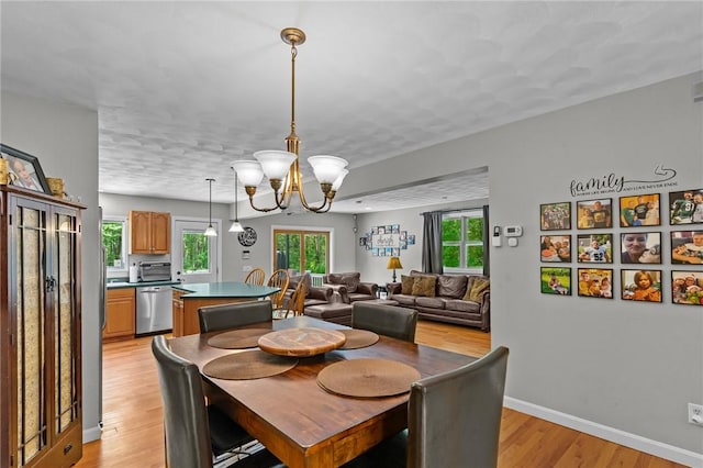 8 Anthony Rd, Foster, RI 02825 - dining room with light wood-style floors and a chandelier