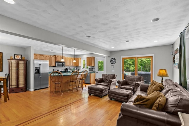 8 Anthony Rd, Foster, RI 02825 - living area with light wood finished floors and recessed lighting