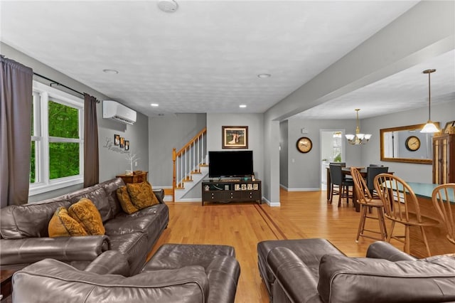 8 Anthony Rd, Foster, RI 02825 - living area with a chandelier, light wood-type flooring, stairway, a wall mounted air conditioner, and recessed lighting