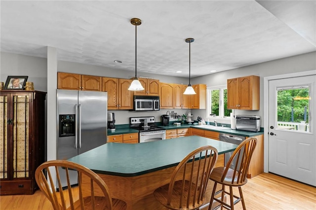 8 Anthony Rd, Foster, RI 02825 - kitchen featuring stainless steel appliances, light wood finished floors, a kitchen bar, dark countertops, and recessed lighting