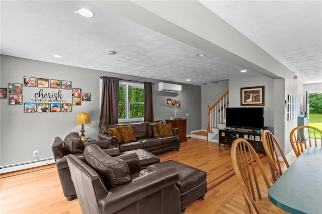 8 Anthony Rd, Foster, RI 02825 - living room with stairs, an AC wall unit, a baseboard heating unit, light wood-style floors, and recessed lighting