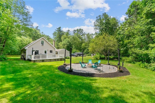 8 Anthony Rd, Foster, RI 02825 - view of green lawn with a fire pit, a deck, and a patio area