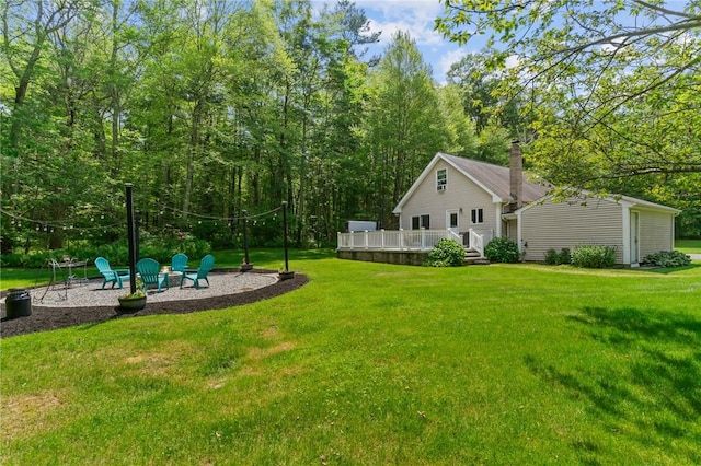 8 Anthony Rd, Foster, RI 02825 - view of grassy yard featuring a wooden deck and an outdoor fire pit